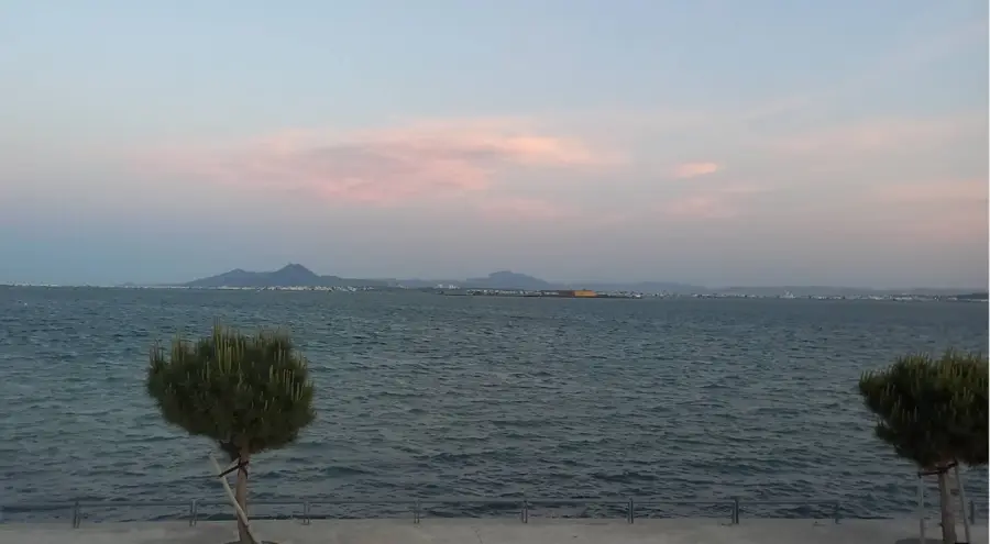 Mount Boukornine at dusk seen from the lakeshore