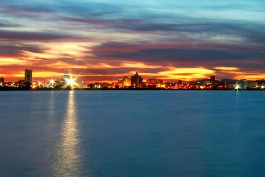 The lights of Tunis reflected on the lake at dusk